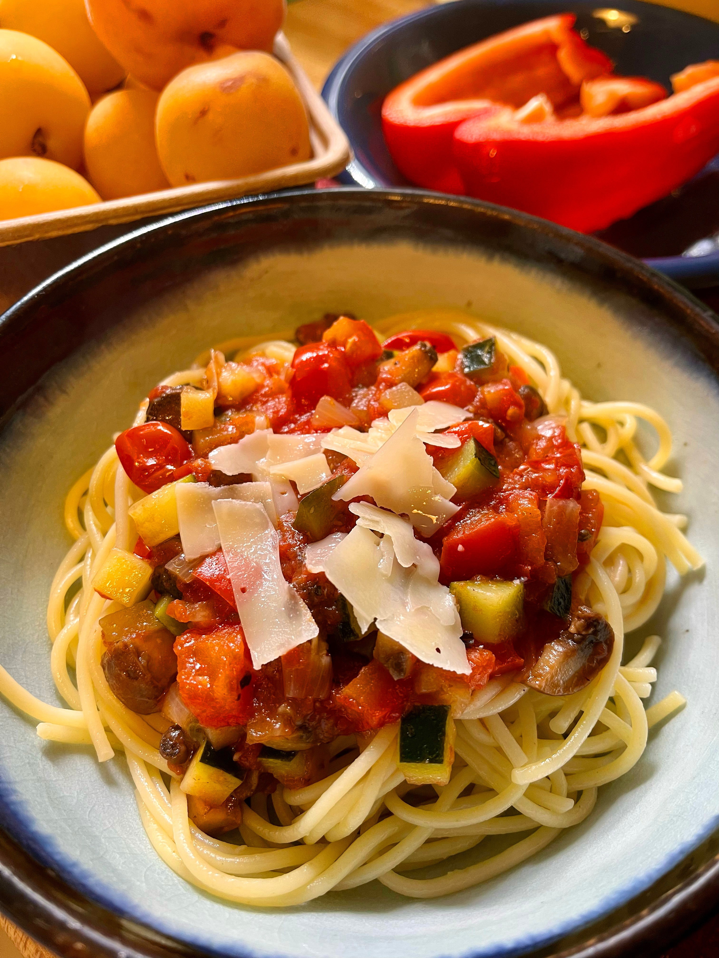 Top view angle of a tomato based pasta sauce over spaghetti in a bowl