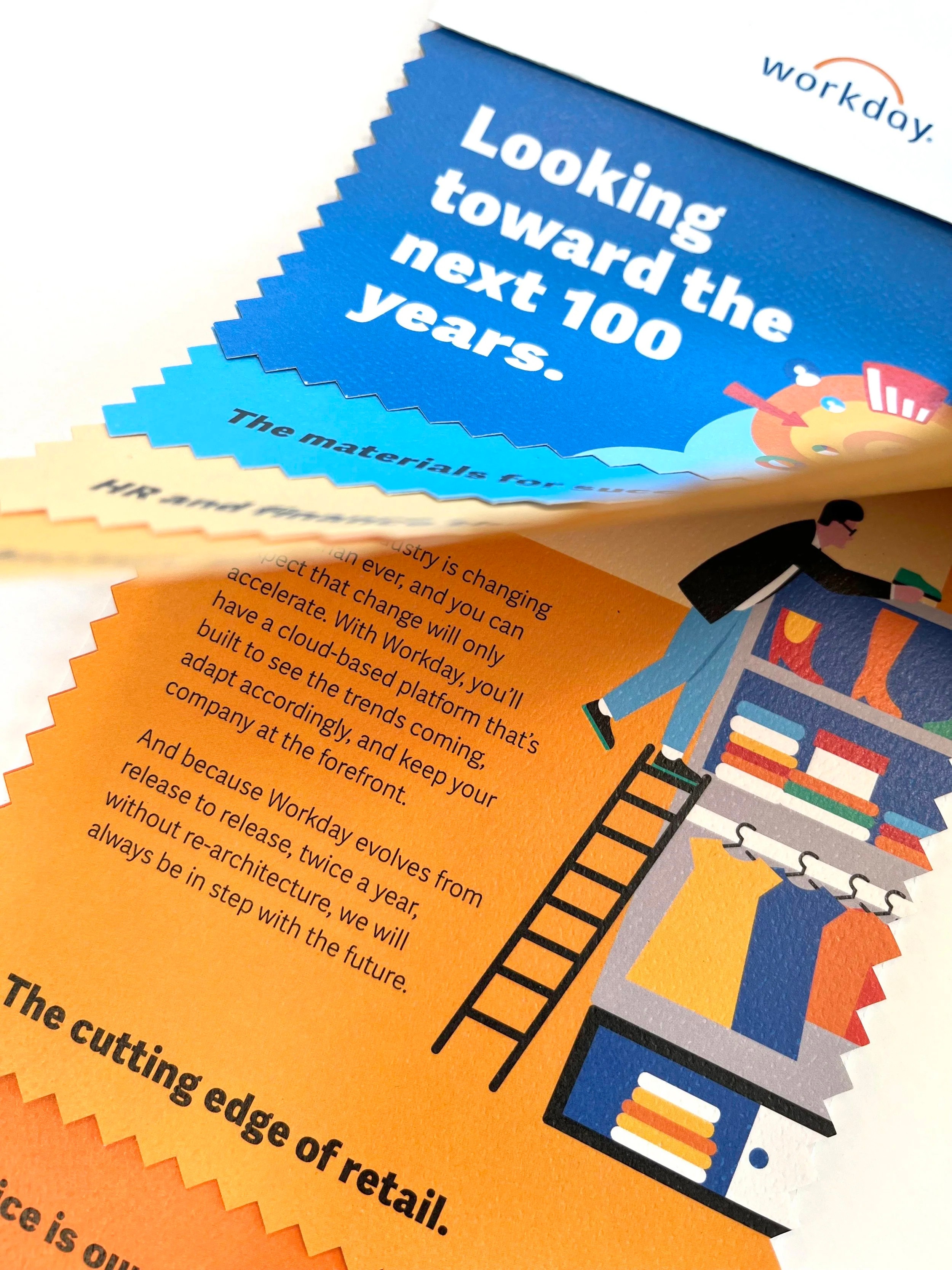 Close up of a printed piece with a page flipped upwards to show a chart