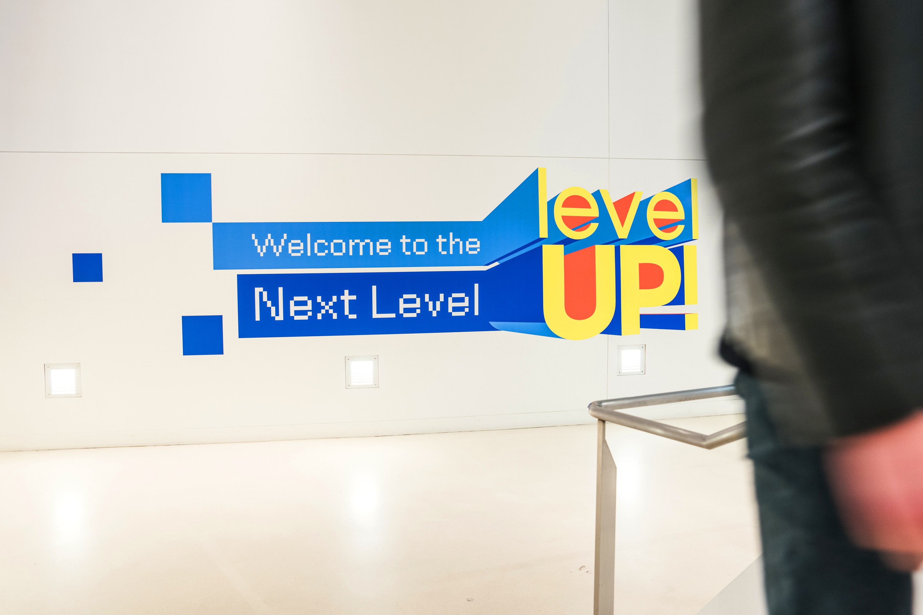 Wall graphics at a stair landing at the LevelUp event