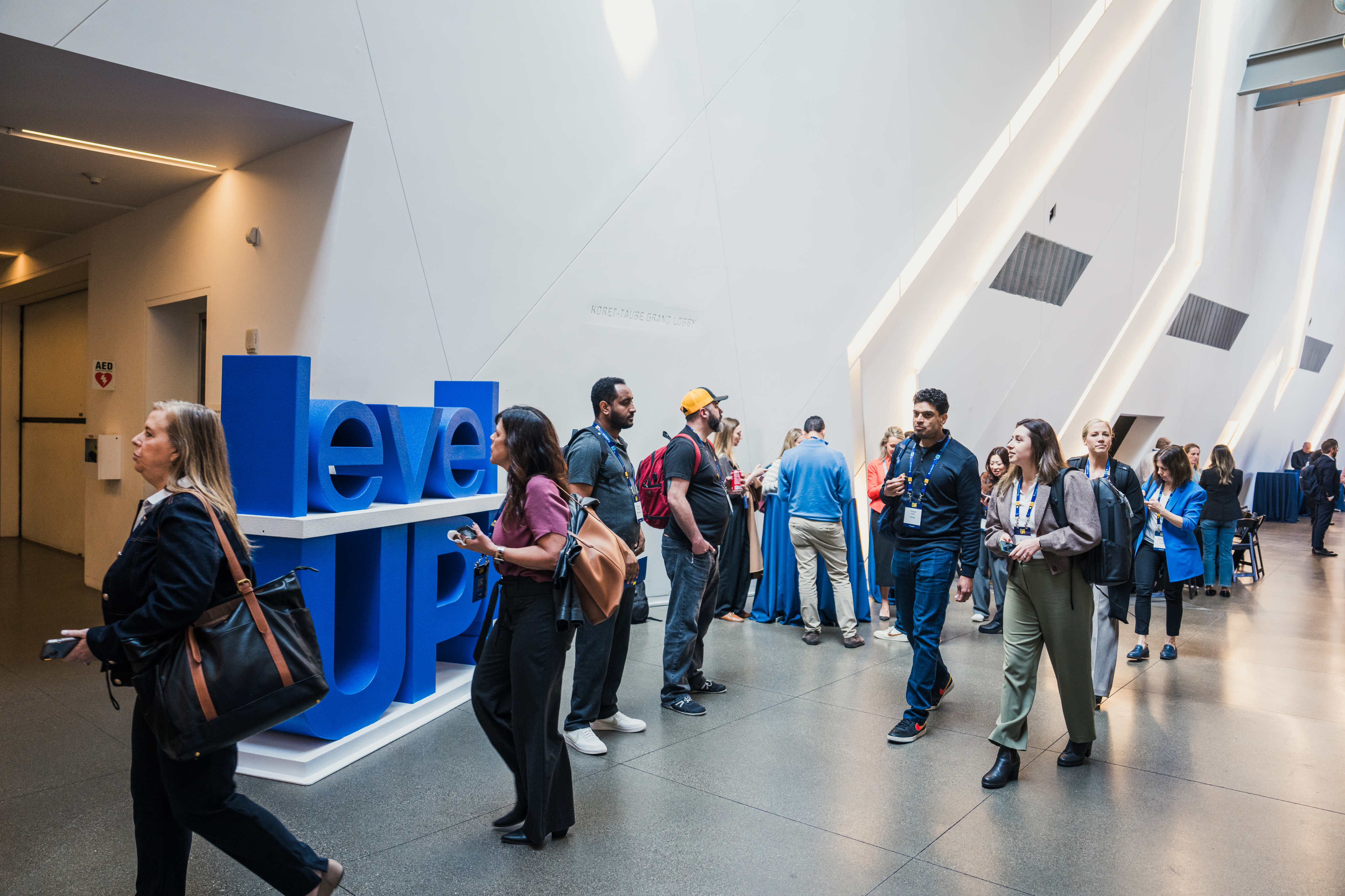 Attendees walking by a 3d sculpture at the LevelUp event